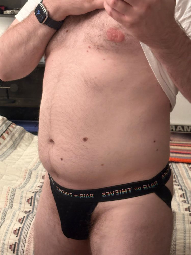 Brady lifting his shirt, exposing his black jockstrap, showing belly, with a peek of chest and nipple