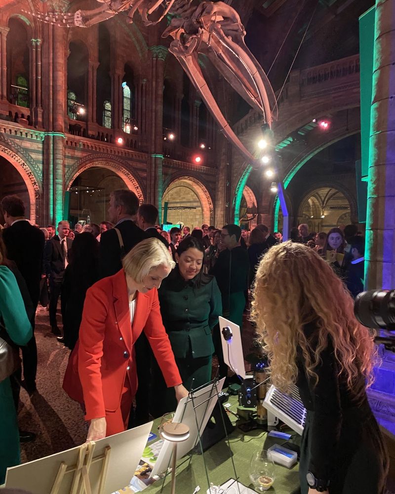 Emma Reynolds, Secretary of State for Environment, Food and Rural Affairs (in red) at the UKCEH stand