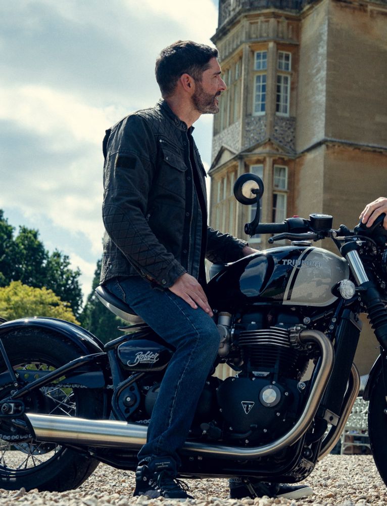 Tom Ellis on a motorcycle in The Thursday Murder Club