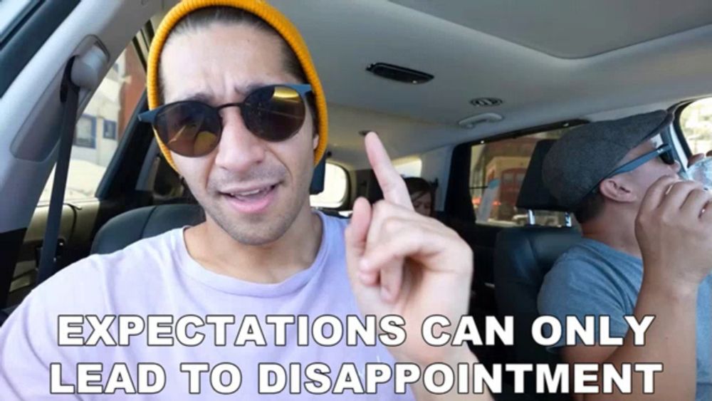 a man in a car with the words expectations can only lead to disappointment above him