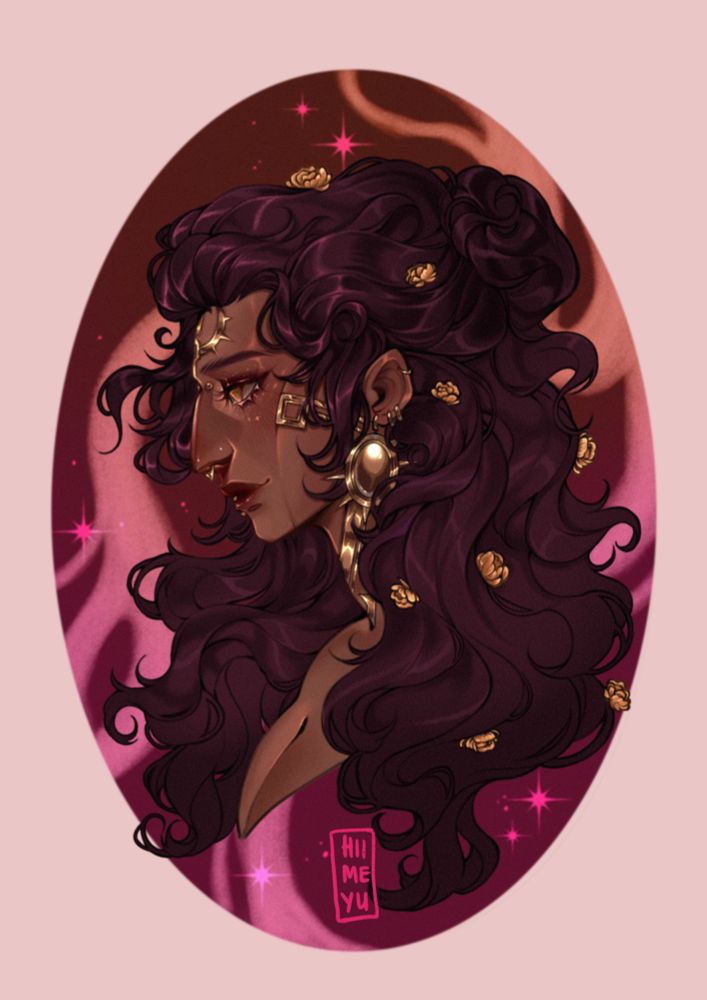 A tan woman is seen in profile, she has auburn curly hair and lots of golden jewelry. Her hair is in a half updo and she smiles gently.