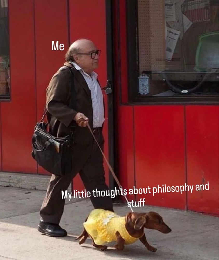 Danny DiVito walking a sausage dog. 