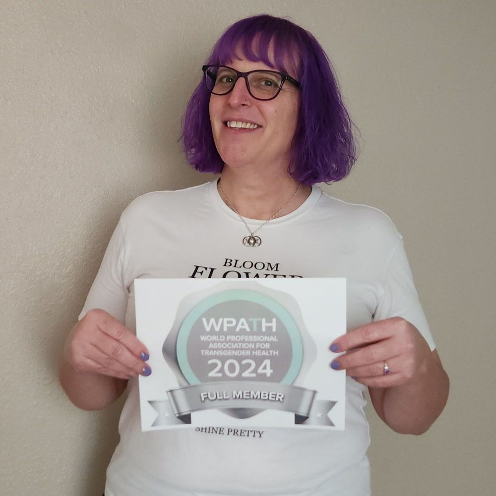Amethysta Herrick, Ph.D. displays her WPATH 2024 badge
