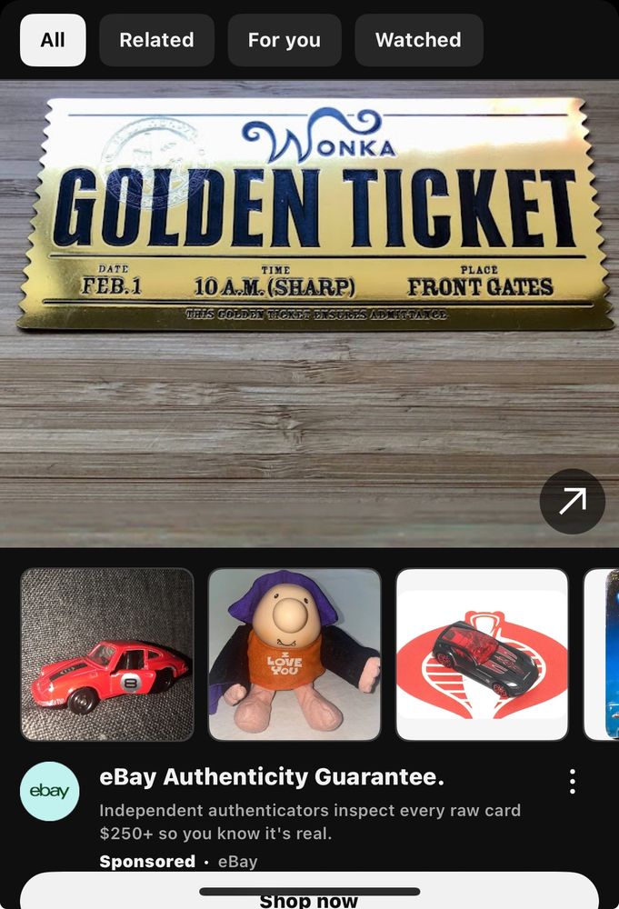 youtube ad for ebay, the most prominent item is a wonka golden ticket...
other items include a toy car, a funny little guy with an "i love you" shirt, another toy car, and something offscreen