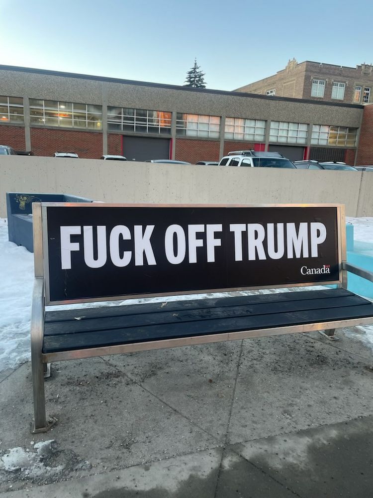 Bus bench in Canada that reads “Fuck Off Trump”