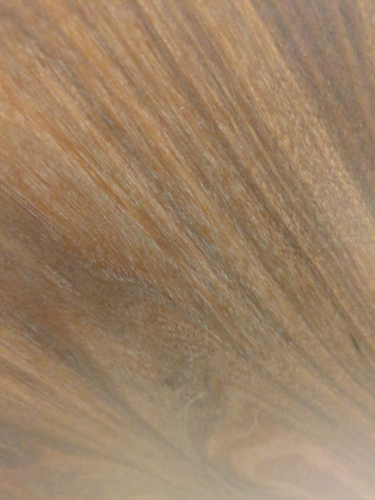 A wood veneer up too close to identify on what