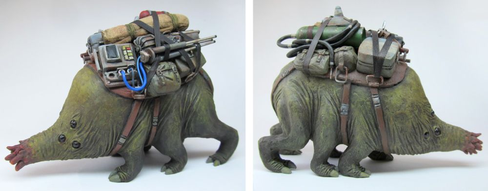 A sculpture of a six legged creature carrying a load of equipment. 