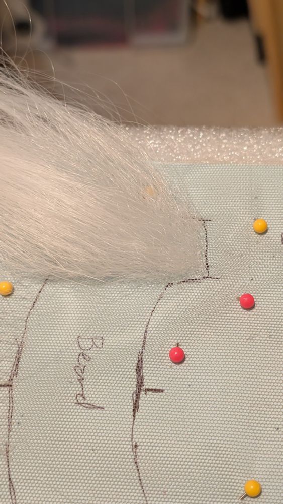 Hair wefts sewn into a sheet of lace. 
Approximately one fifth of the beard has been made so far.