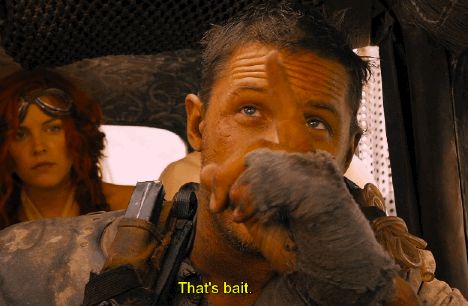 tom hardy in mad max: fury road pointing at the skeet above and saying 'that's bait'