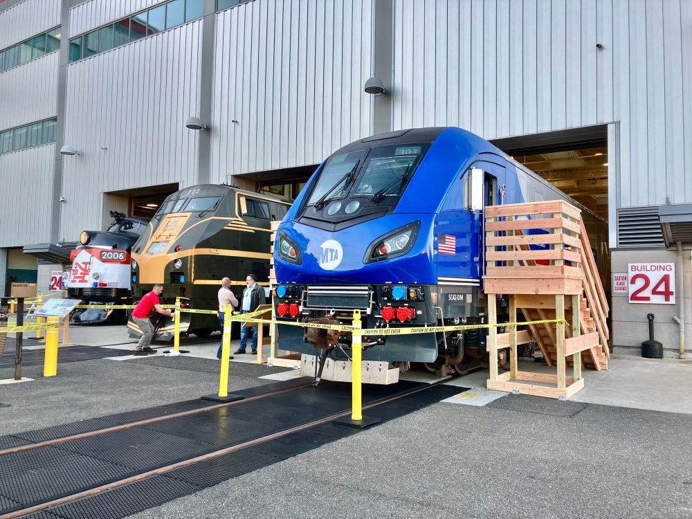 Three Metro-North locomotives lined up on display outside at the shop.