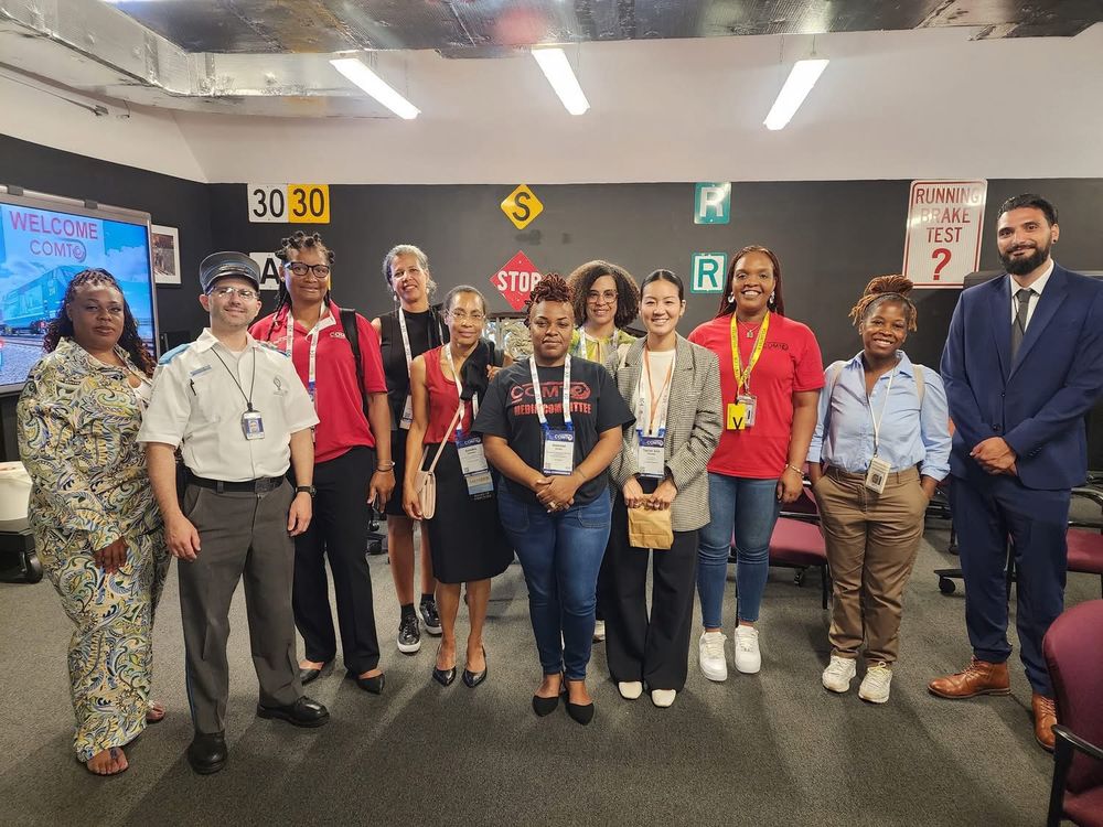 COMTO attendees posed with Metro-North senior leadership inside a classroom.