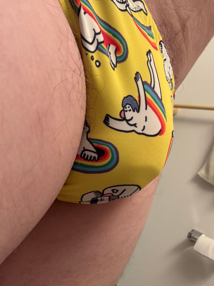 Side view of a man in a yellow speedo
