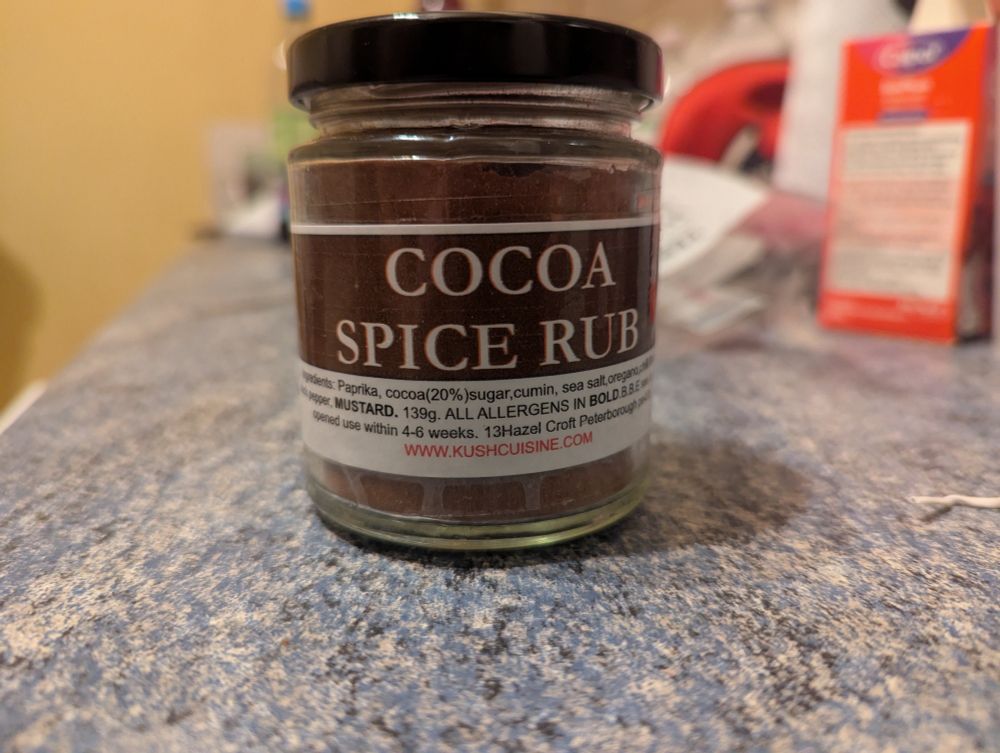 Close up of a jar with cocoa spice rub
The rub in the jar is a brown colour
