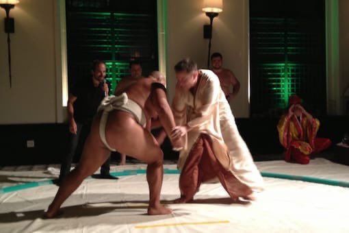 Elon Musk in Jedi robes during a sumo wrestling match about to get his ass handed to him