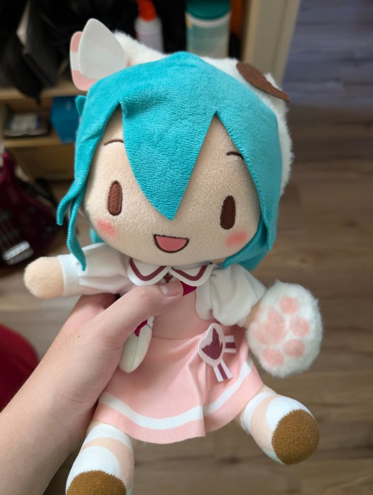 small fuwapuchi miku being held in my left hand