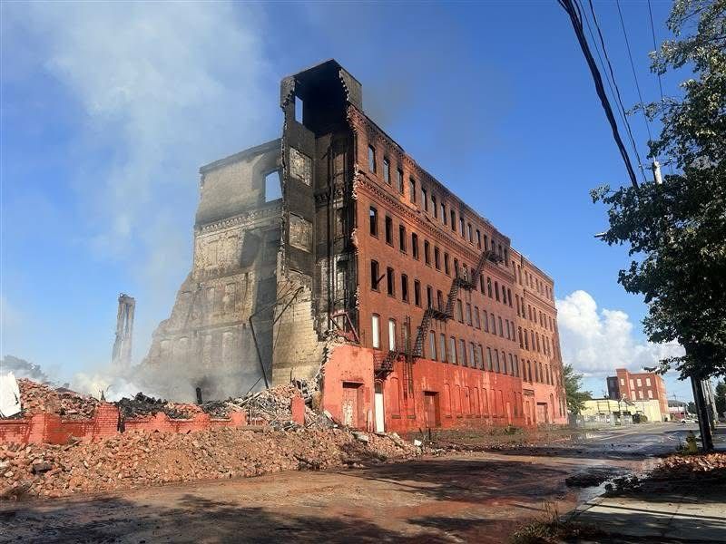 Smoldering 5 story brick building 