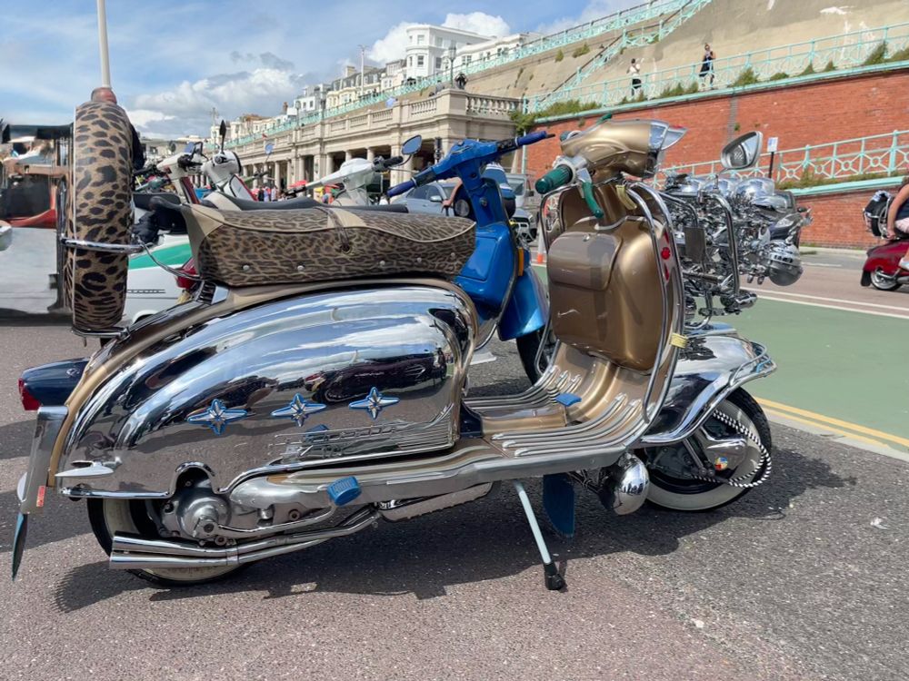 Silver moped in Madeira Drive, Brighton