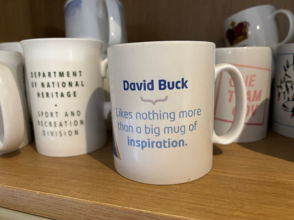 The mug bit of the cupboard with the mug’s carefully arranged to show a mug from a previous UK Gov Camp, my 1st civil service mug, one tea gov mug, the ones my daughter made and the a crown one at the back. 