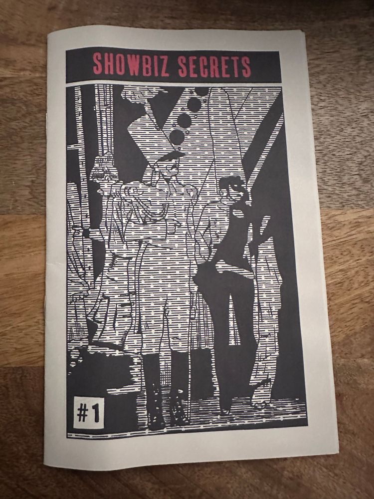 A black and white comic zine called Showbiz Secrets with a cover of a soldier and maybe a robot?