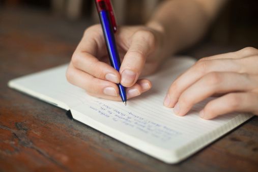 Hand writing in notebook