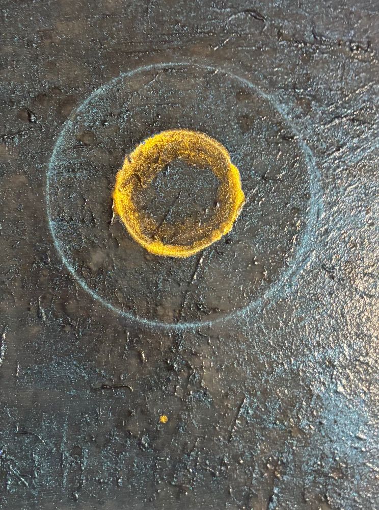 greens browns blue and golds circular pattern