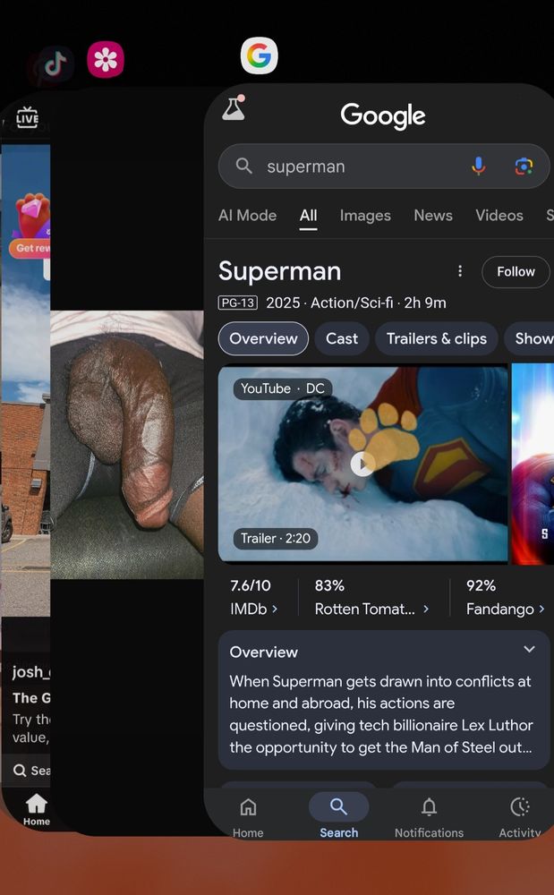 Screenshot of a smartphone's app switcher. The first app in the stack is a Google search for Superman. The second app is a photo of a semi erect penis pointing downwards.