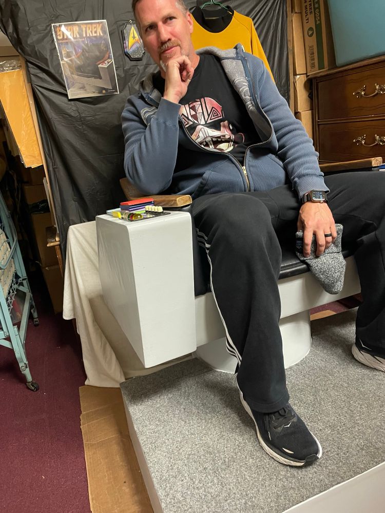 Seth Singleton sitting on the Official replica Star Trek Enterprise Captain’s Chair. 
