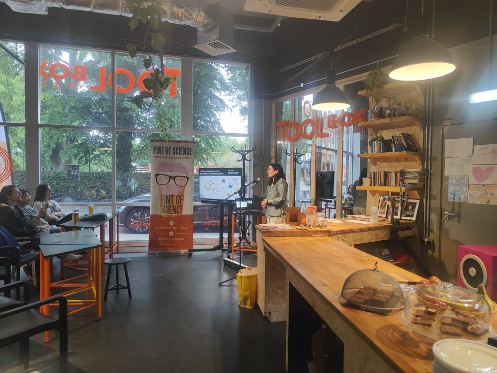 A pint of science speaker talking into a microphone