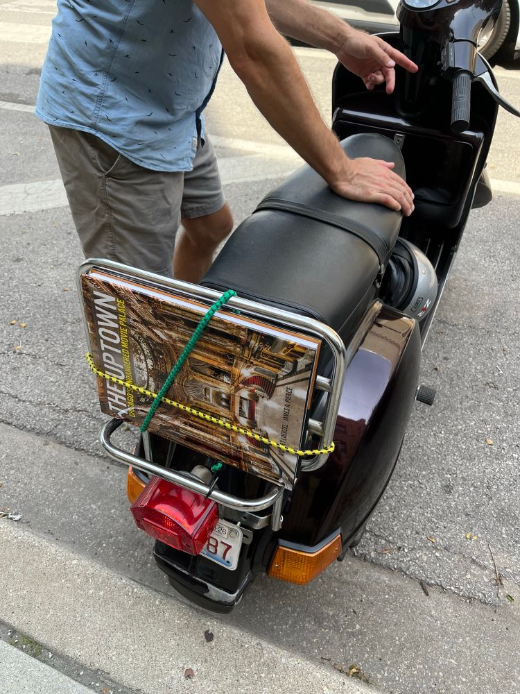 New book about the Uptown Theatre by Robert Loerzel and James A. Pierce strapped to the back of a ‘79 Vespa. 