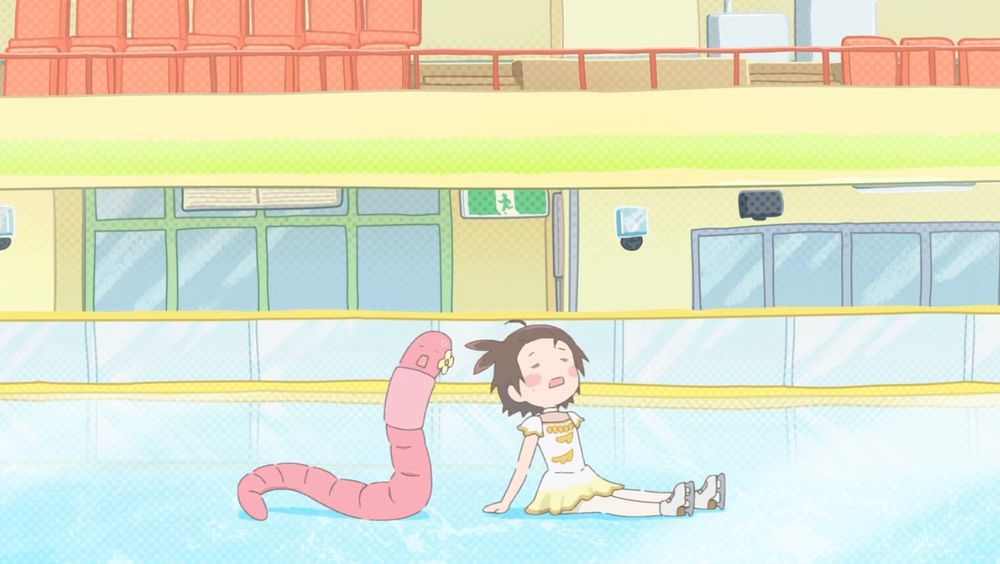 Screencap from the Medalist anime ending.  Inori, an elementary school ice skater in a yellow costume, sits and rests in an ice skating rink.  A cartoon earthworm about the same size as her with a yellow flower next to its face sits beside her, resting in a similar pose.