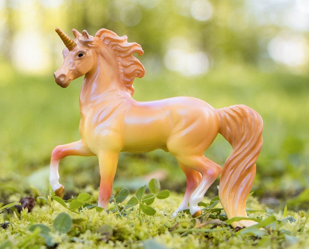 A product photo of the same G2 prancing Morgan (unicorn), showing what he looked like prior to the application of pastels: Shades of yellow and orange and a bit of pink.