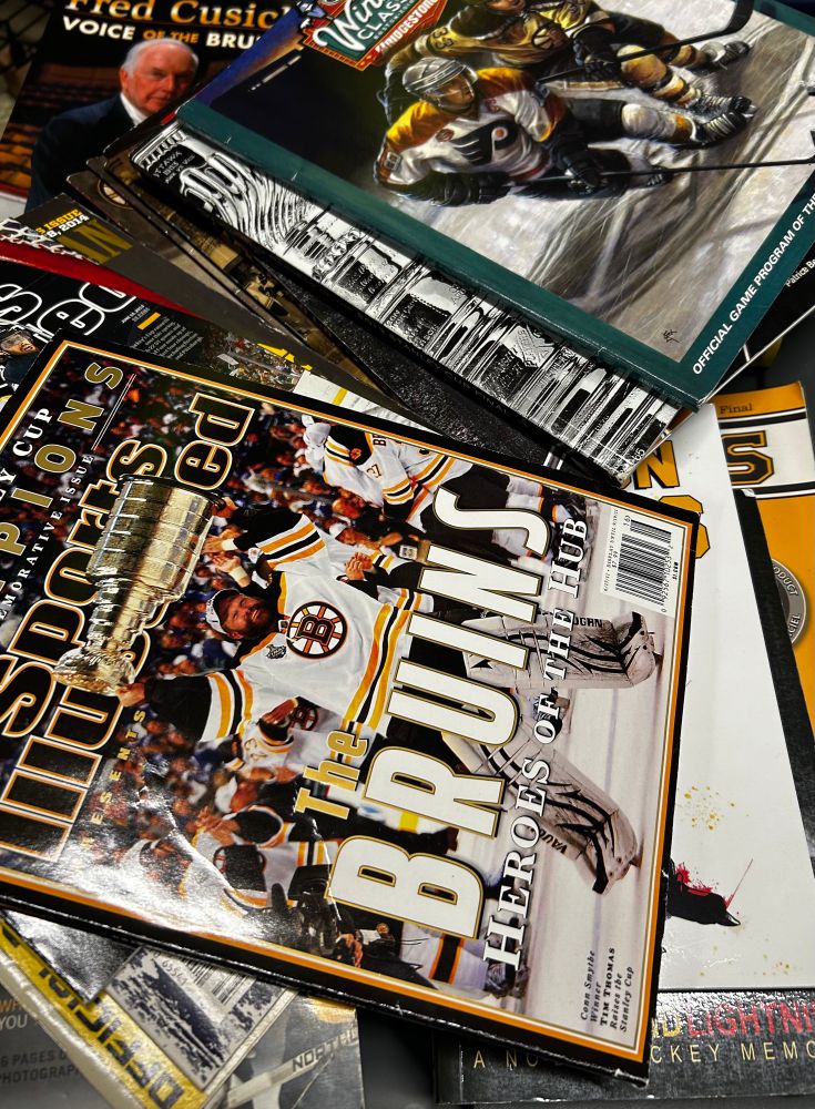 A pile of Boston Bruins books, magazines, and game programs. ISO Full 60+ to History 👀