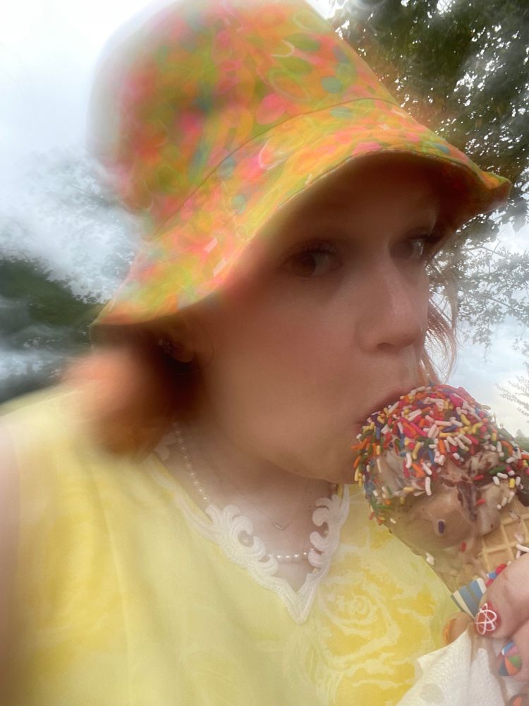 blurry selfie earring a melting ice cream cone in fog