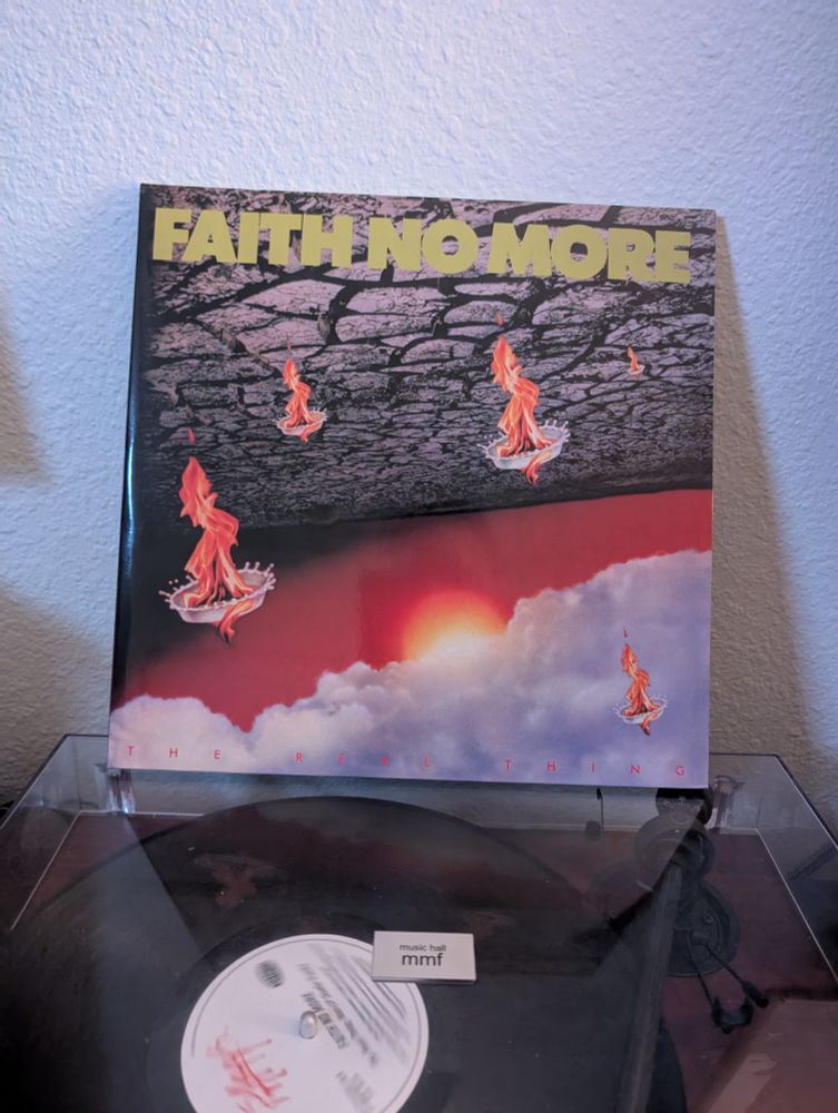 Album cover of Faith No More's "The Real Thing" sitting on top of a turntable.