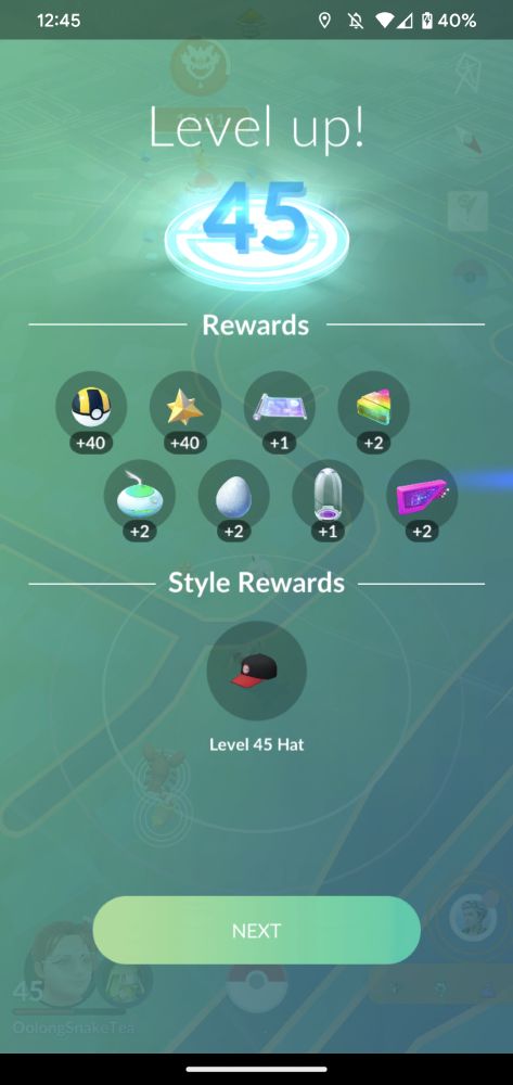 Pokemon Go levle 45 reward leve up screen. It is a green screen with rewards for in game, Text reads: level up! 45 rewards style rewards level 45 hat and a next button. 