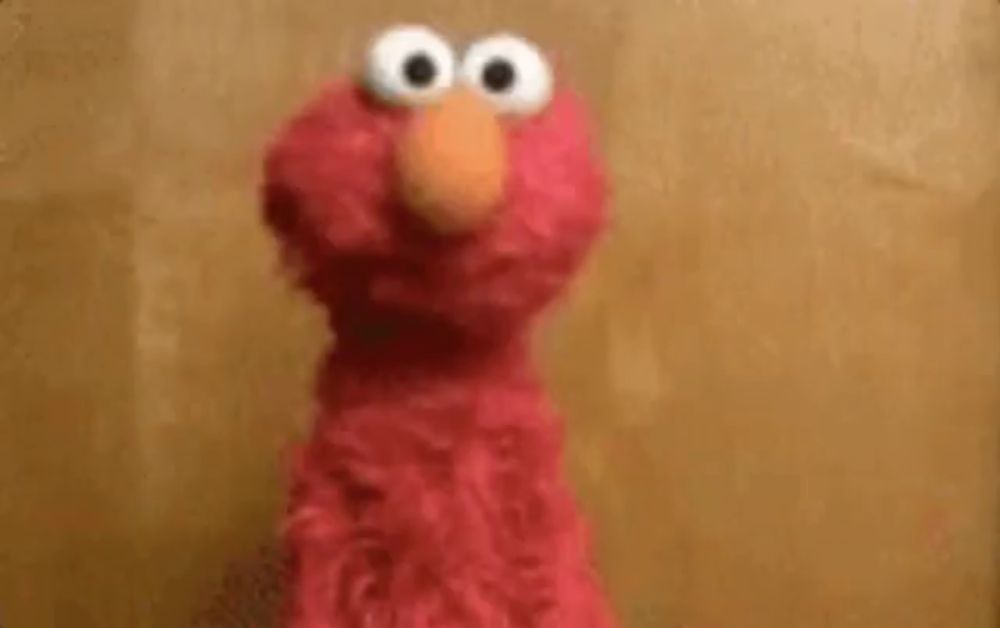 elmo from sesame street is talking in a foreign language .