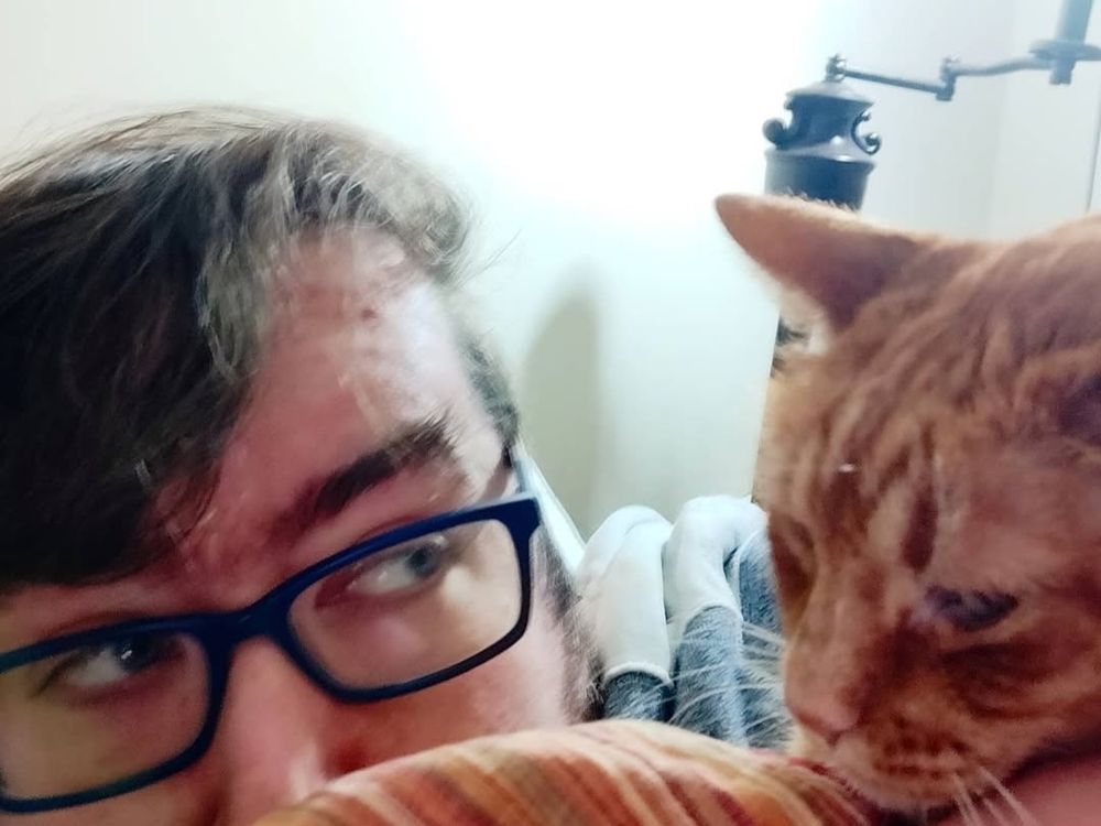 Me peeking up behind a counter at my cat
