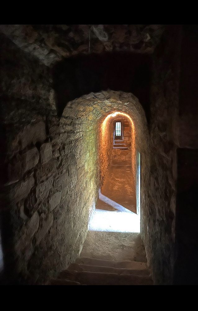 Image: A dead-end path in a mold~infested dungeon. One side of the tunnel leads to prison bars; the other leads to darkness. But in the middle of the path, a ray of light shines from an unseen doorway, illuminating the stone floor and showing a possible escape route. 

I Am Chosen~ Paranormal Romance with thriller elements. 

Photography and story by Dawn Berkoski. 