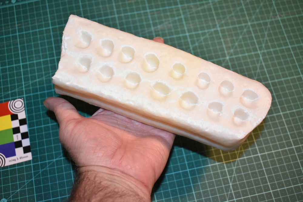 A 3D print of the digital model in a person's hand.