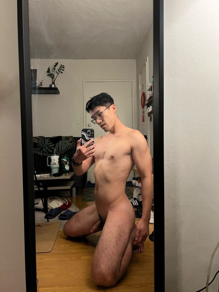 I’m on my knees in front of a mirror showing off my body 