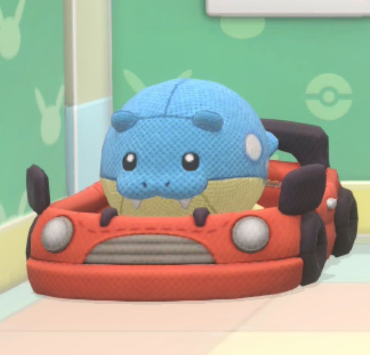 Spheal plush from pokemon friends sat in a racecar bed