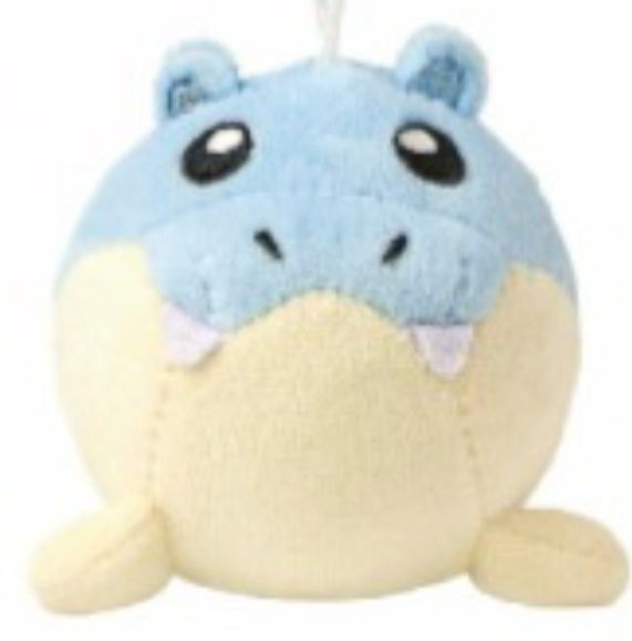 A close up of the new spheal pokemon plush. It has huge nostrils for some reason