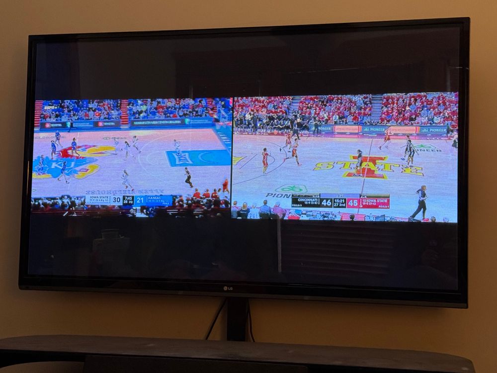 Tv screen broadcasting two games at once. 