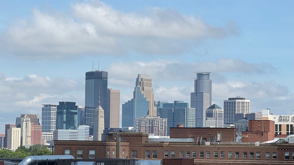 Minneapolis skyline against a beautiful blue sky. 