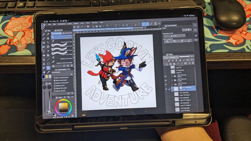 Another photo of my tablet opened with Clip Studio Paint open on its screen and a drawing of Ethera and G'raha