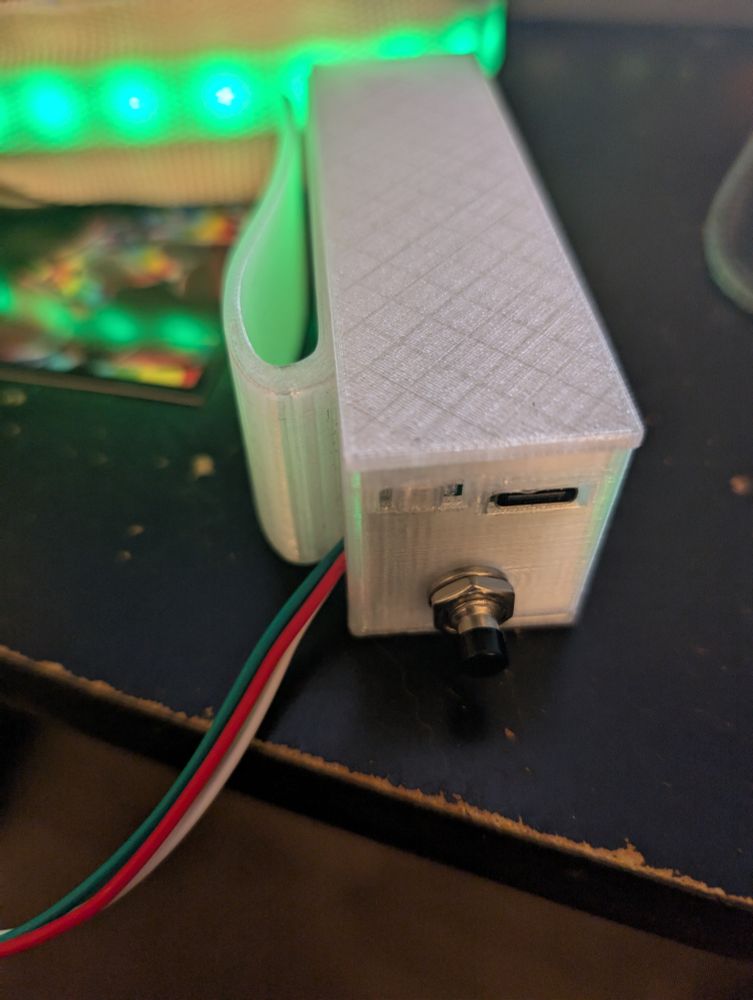 Close up showing the face of the controller (switched on with green LED in the background)
