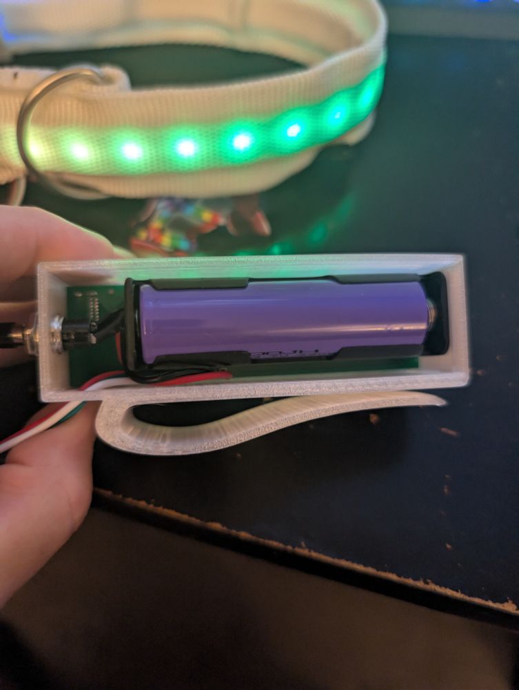 Controller bottom showing bottom plate removed and 18650 battery. 