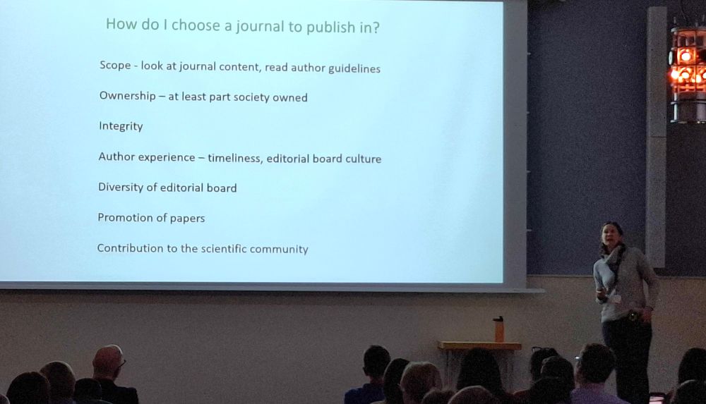 Katherine Denby on stage at MBP2025. Her slide has the headline "How do I choose a journal to publish in?"
The points are:
Scope - look at journal content, read author guidelines
Ownership - at least part society owned
Integrity
Author experience - timelines, editorial board culture
Diversity of editorial board
Promotion of papers
Contribution to the scientific community