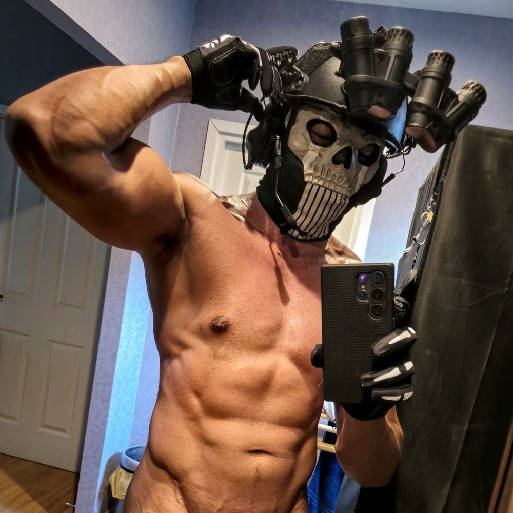 Call of duty Ghost cosplay wearing only his head gear without any cloths. Photo is cropped above the waistline.
