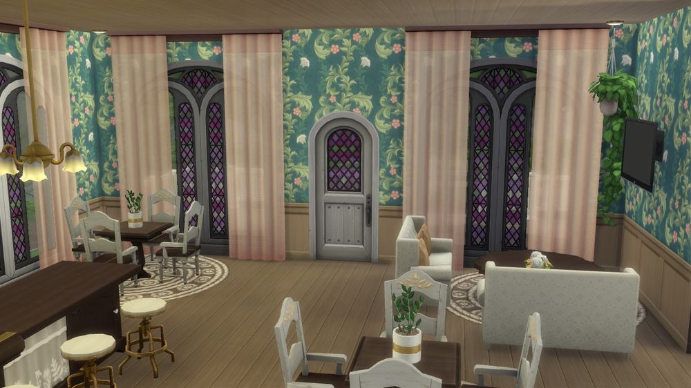 Close-up of the table and chairs and tv area on the other side of the room.